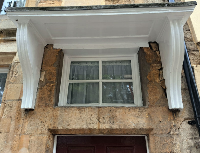 Lintel with roman numeral